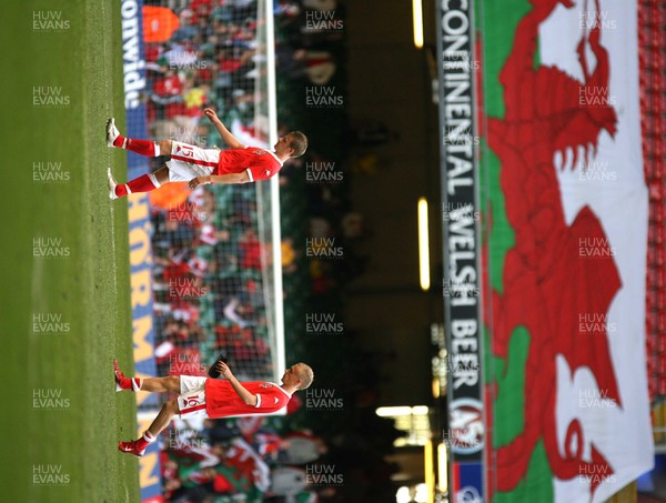 07.10.06...Wales v Slovakia, Euro 2008 Qualifying Match, Cardiff Wales Paul Parry and David Cotterill leave the field at the end of the match 