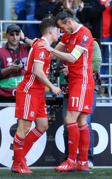 240319 - Wales v Slovakia - UEFA EURO 2020 Qualifier - Daniel James of Wales celebrates scoring a goal with Gareth Bale