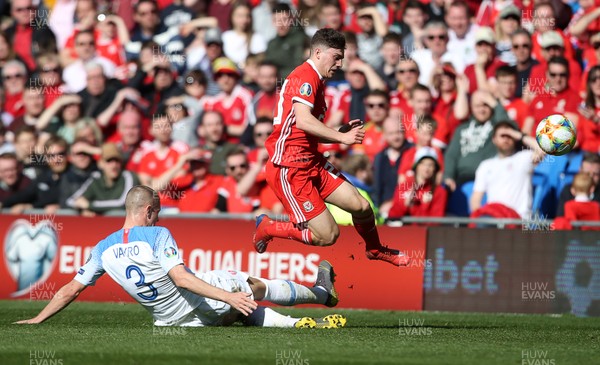 240319 - Wales v Slovakia - UEFA EURO 2020 Qualifier - Daniel James of Wales is tackled by Denis Varro of Slovakia