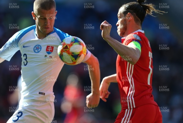 240319 - Wales v Slovakia, UEFA Euro 2020 Qualifier - Gareth Bale of Wales takes on Denis Varro of Slovakia