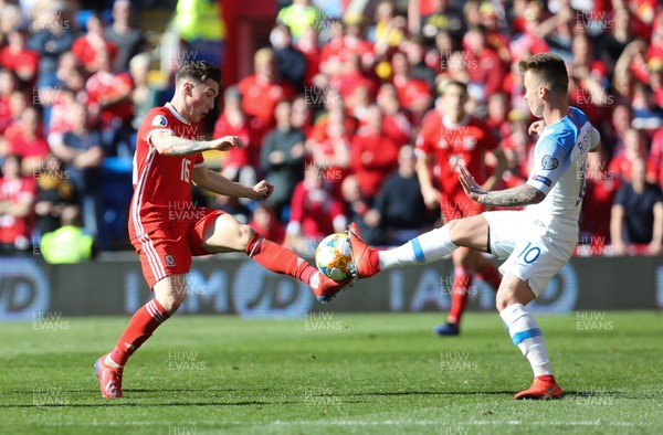 240319 - Wales v Slovakia, UEFA Euro 2020 Qualifier - Harry Wilson of Wales is challenged by Albert Rusnak of Slovakia for the ball