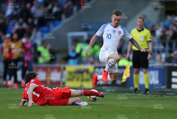240319 - Wales v Slovakia, UEFA Euro 2020 Qualifier - Albert Rusnak of Slovakia is tackled by Joe Allen of Wales