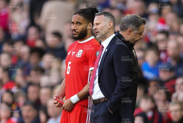 240319 - Wales v Slovakia, UEFA Euro 2020 Qualifier - Ashley Williams of Wales seeks to Wales coach Ryan Giggs as he prepares to come onto the pitch