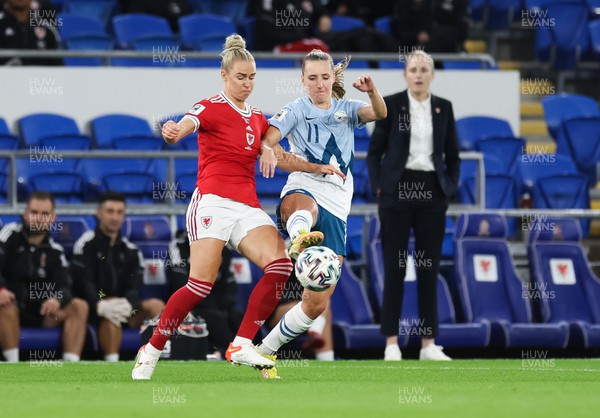 060922 - Wales v Slovenia, FIFA Women's World Cup 2023 Qualifier - Rhiannon Roberts of Wales and Izabela Krizaj of Slovenia compete for the ball