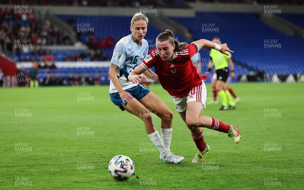 060922 - Wales v Slovenia, FIFA Women's World Cup 2023 Qualifier - Carrie Jones of Wales gets past Kaja Erzen of Slovenia