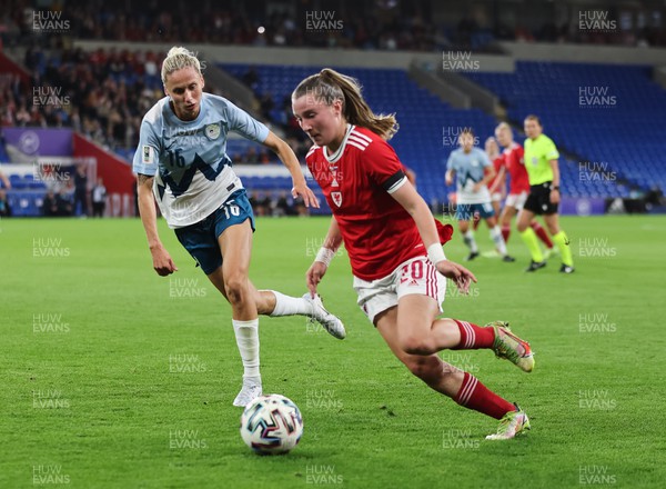 060922 - Wales v Slovenia, FIFA Women's World Cup 2023 Qualifier - Carrie Jones of Wales gets past Kaja Erzen of Slovenia