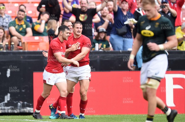 020618 - Wales v South Africa - International Rugby - Hallam Amos of Wales celebrates his try with Tomos Williams and Tom Prydie
