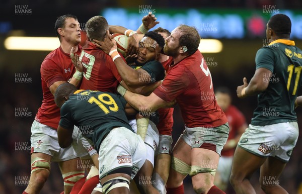 021217 - Wales v South Africa - Under Armour Series - Lukhanyo Am of South Africa is held by Scott Williams and Alun Wyn Jones of Wales in the last play of the game