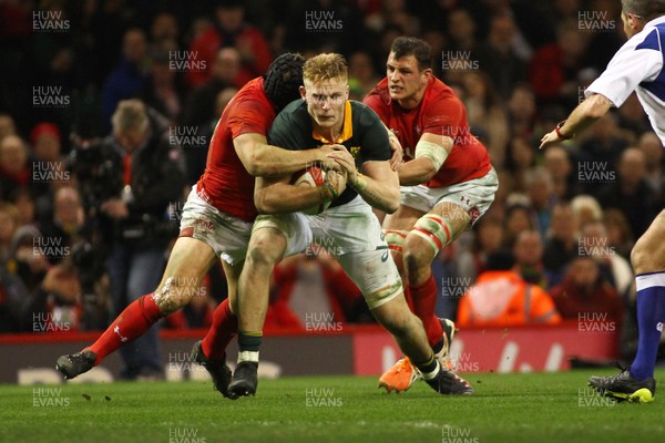 021217 Wales v New South Africa - Under Armour 2017 Series -  Dan du Preez of South Africa is tackled by Leigh Halfpenny and Aaron Shingler of Wales