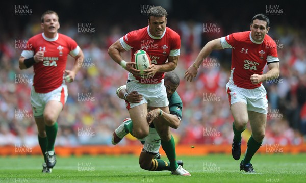 05.06.10 - Wales v South Africa - Principality Building Society Summer Test - Jamie Roberts of Wales is tackled by Juan de Jongh of South Africa. 