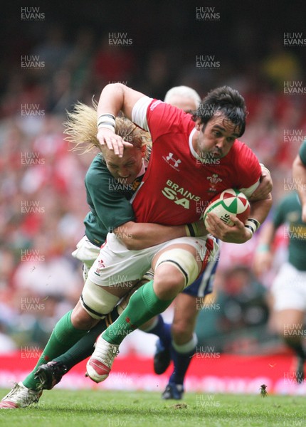 05.06.10 Wales v South Africa... Wales' Jonathan Thomas is tackled by South Africa's Dewald Potgieter. 