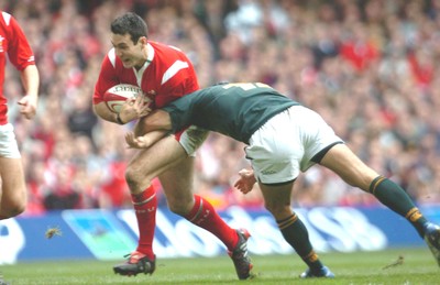 6-11-04. Wales v South Africa. Autumn International.  Wales' Stephen Jones tries to get past Marius Joubert.  