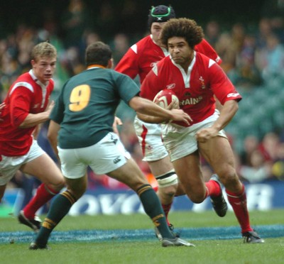 6-11-04. Wales v South Africa. Autumn International.  Wales' Colin Charvis charges at Fourie De Preez.  