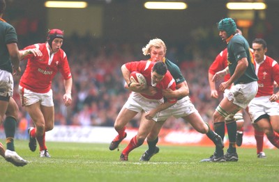 06.11.04 Wales v S.Africa,Cardiff  Wales Stephen Jones is tackled by Schalk Burger  Huw Evans,Cardiff