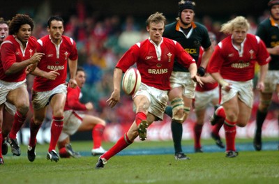 6-11-04. Wales v South Africa. Autumn International.  Wales' Dwayne Peel chips ahead as he makes a break.  