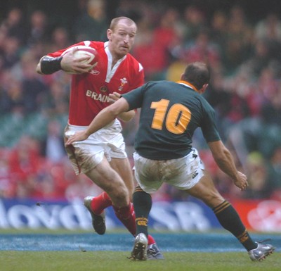 6-11-04. Wales v South Africa. Autumn International.  Wales captain Gareth Thomas takes on Jaco Van Der Westhuyzen  