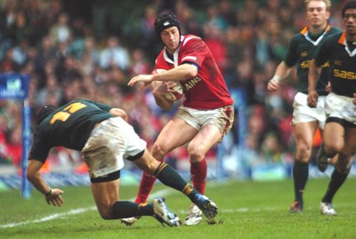 6-11-04. Wales v South Africa. Autumn International.  Wales' Hal Luscombe gets Barry De Wet from his path.  