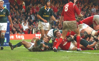 06.11.04 Wales v S.Africa,Cardiff  Wales Dwayne Peel(on floor) celebrates his try  Huw Evans,Cardiff
