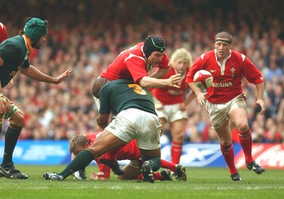 06.11.04 Wales v S.Africa,Cardiff  Wales Michael Owen loses ball in tackle by Eddie Andrews  Huw Evans,Cardiff