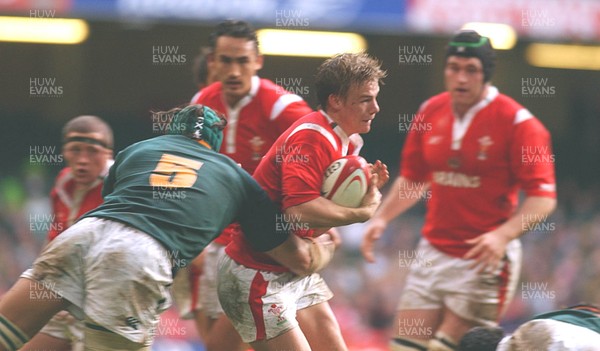 06.11.04 Wales v S.Africa,Cardiff  Wales Dwayne Peel is tackled by Victor Matfield  Huw Evans,Cardiff