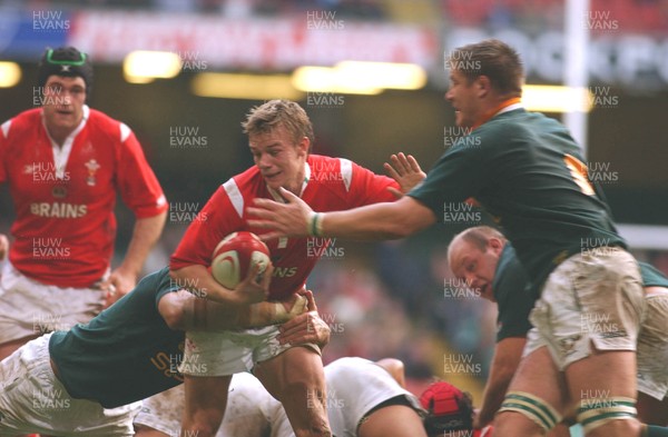 06.11.04 Wales v S.Africa,Cardiff  Wales Dwayne Peel is tackled by Victor Matfield and Bakkies Botha  Huw Evans,Cardiff