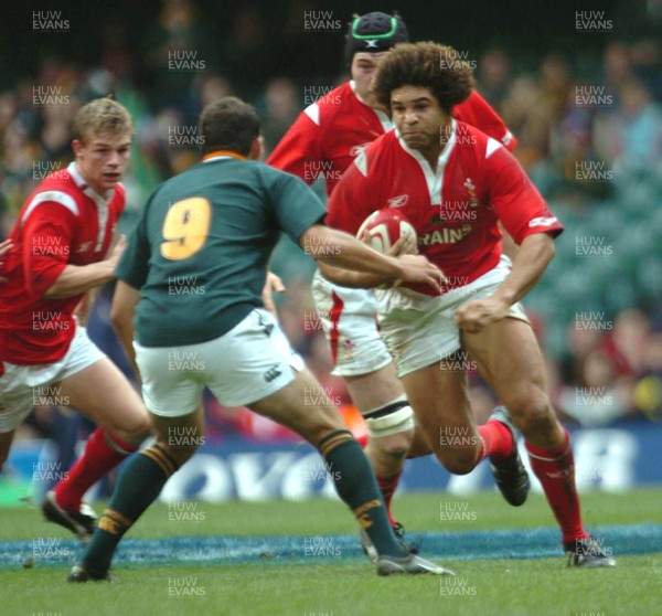 6-11-04. Wales v South Africa. Autumn International.  Wales' Colin Charvis charges at Fourie De Preez.  