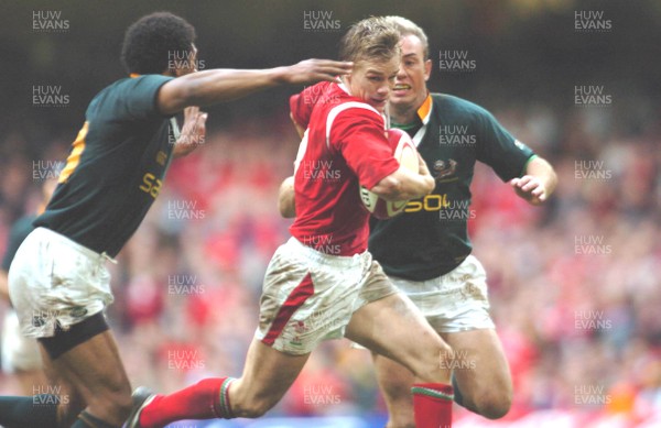 6-11-04. Wales v South Africa. Autumn International.  Wales' Dwayne Peel is caught by Breyton Paulse (left) as he makes break.  