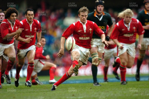 6-11-04. Wales v South Africa. Autumn International.  Wales' Dwayne Peel chips ahead as he makes a break.  