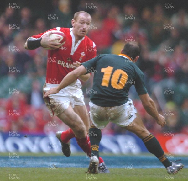 6-11-04. Wales v South Africa. Autumn International.  Wales captain Gareth Thomas takes on Jaco Van Der Westhuyzen  
