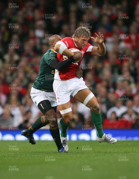 08.11.08 Wales v South Africa... Wales" Andy Powell is tackled by JP Pietersen. 