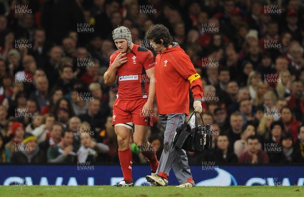 091113 - Wales v South Africa - Dove Men+Care Series -Jonathan Davies of Wales leaves the field with physio Mark Davies