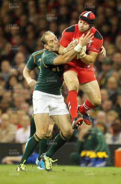 091113  - Wales v South Africa - 2013 Dove Men Series - Leigh Halfpenny of Wales is tackled by Fourie Du Preez of South Africa