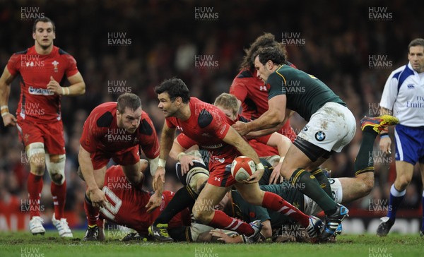 091113 - Wales v South Africa - Dove Men+Care Series -Mike Phillips of Wales is tackled by Bismarck du Plessis of South Africa