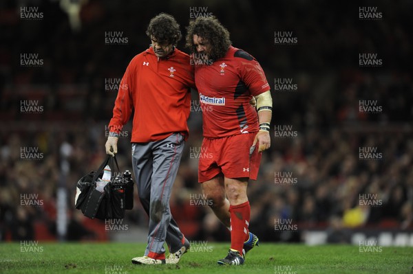 091113 - Wales v South Africa - Dove Men+Care Series -Adam Jones of Wales leaves the field with physio Mark Davies