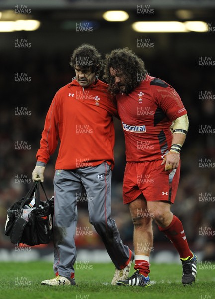 091113 - Wales v South Africa - Dove Men+Care Series -Adam Jones of Wales leaves the field with physio Mark Davies