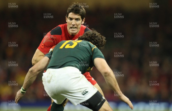 091113 - Wales v South Africa, Dove Mens Autumn Series - Wales' James Hook takes on South Africa's Jaque Fourie