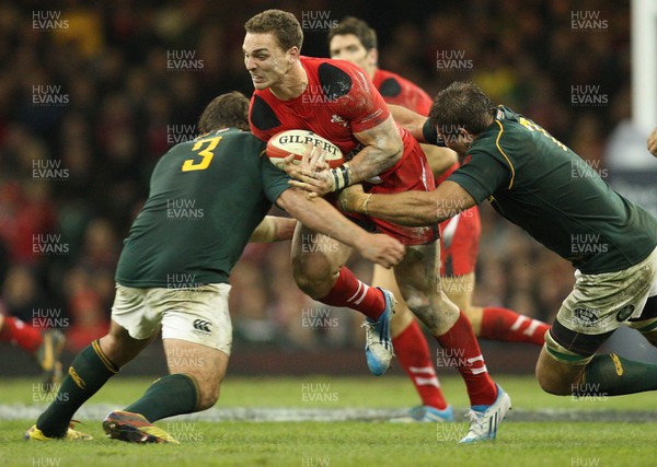 091113 - Wales v South Africa, Dove Mens Autumn Series - Wales' George North is tackled by South Africa's Frans Malherbe and South Africa's Willem Alberts