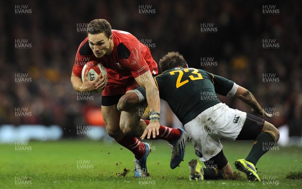 091113 - Wales v South Africa - Dove Men+Care Series -George North of Wales is tackled by Willie le Roux of South Africa