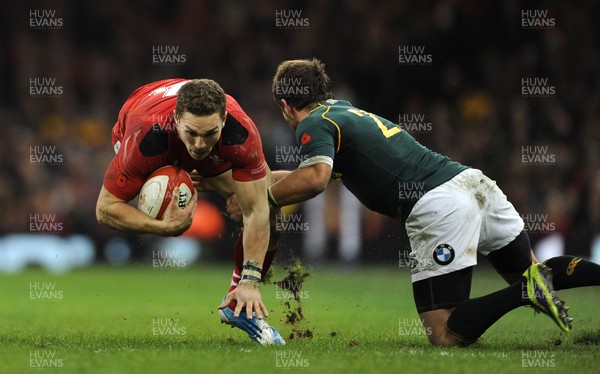 091113 - Wales v South Africa - Dove Men+Care Series -George North of Wales is tackled by Willie le Roux of South Africa