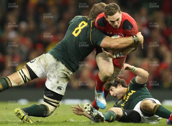 091113 - Wales v South Africa, Dove Mens Autumn Series - Wales' George North is tackled by South Africa's Duane Vermeulen