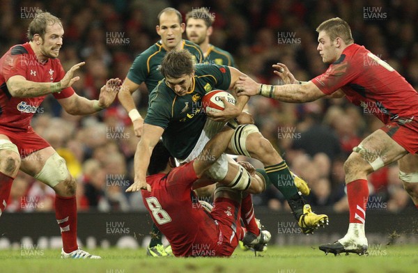 091113 - Wales v South Africa, Dove Mens Autumn Series - South Africa's Eben Etzebeth is tackled by Wales' Toby Faletau