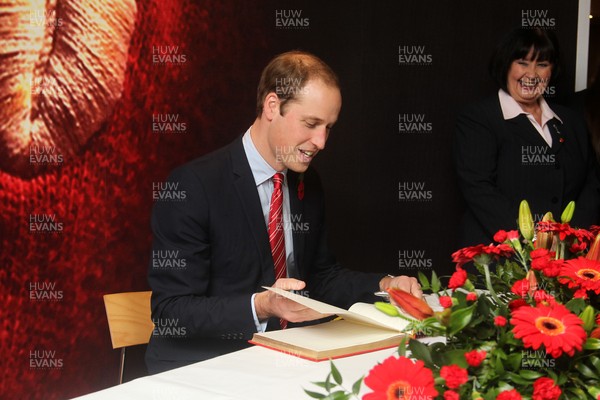 091113  - HRH Duke of Cambridge signs the visitors book during a visit to the Millennium Stadium before the game Wales v South Africa