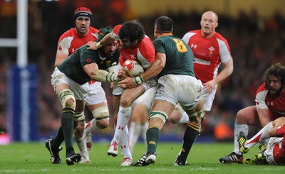 13.11.10 - Wales v South Africa - Invesco Perpetual Series 2010 - Mike Phillips of Wales is tackled by Victor Matfield and Pierre Spies of South Africa. 