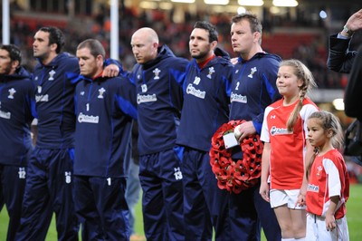 13.11.10 - Wales v South Africa - Invesco Perpetual Series 2010 - Jonathan Thomas, Paul James, Tom Shanklin, Stephen Jones and Matthew Rees line up for the national anthems with mascots Leona and Ruby Cook. 