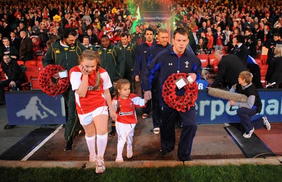 13.11.10 - Wales v South Africa - Invesco Perpetual Series 2010 - Wales captain Matthew Rees leads out his team with mascots Leona and Ruby Cook. 