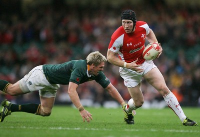 13.11.10 Wales v South Africa... Wales' Tom Shanklin beats tackle by South Africa's Juan De Villiers. 