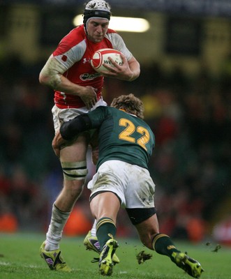 13.11.10 Wales v South Africa... Wales' Ryan Jones is tackled by South Africa's Patrick Lambie. 