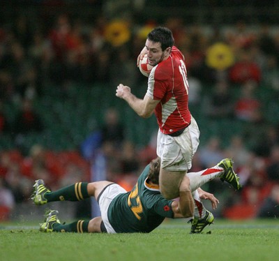 13.11.10 Wales v South Africa... Wales' Stephen Jones is tackled by South Africa's Patrick Lambie. 