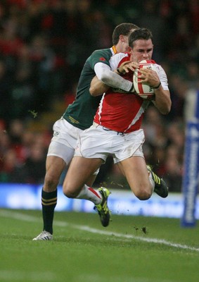 13.11.10 Wales v South Africa... Wales' Lee Byrne is tackled by South Africa's Bjorn Basson. 