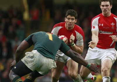 13.11.10 Wales v South Africa - Autumn International Series -   Wales' James Hook takes the hit from South Africa's Tendai Mtawarira. 